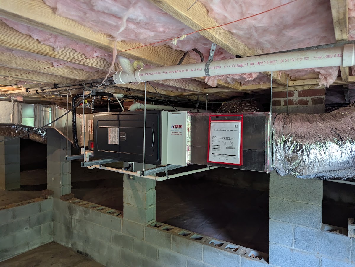technician inspecting inverter heat pump system ratings in Asheboro NC